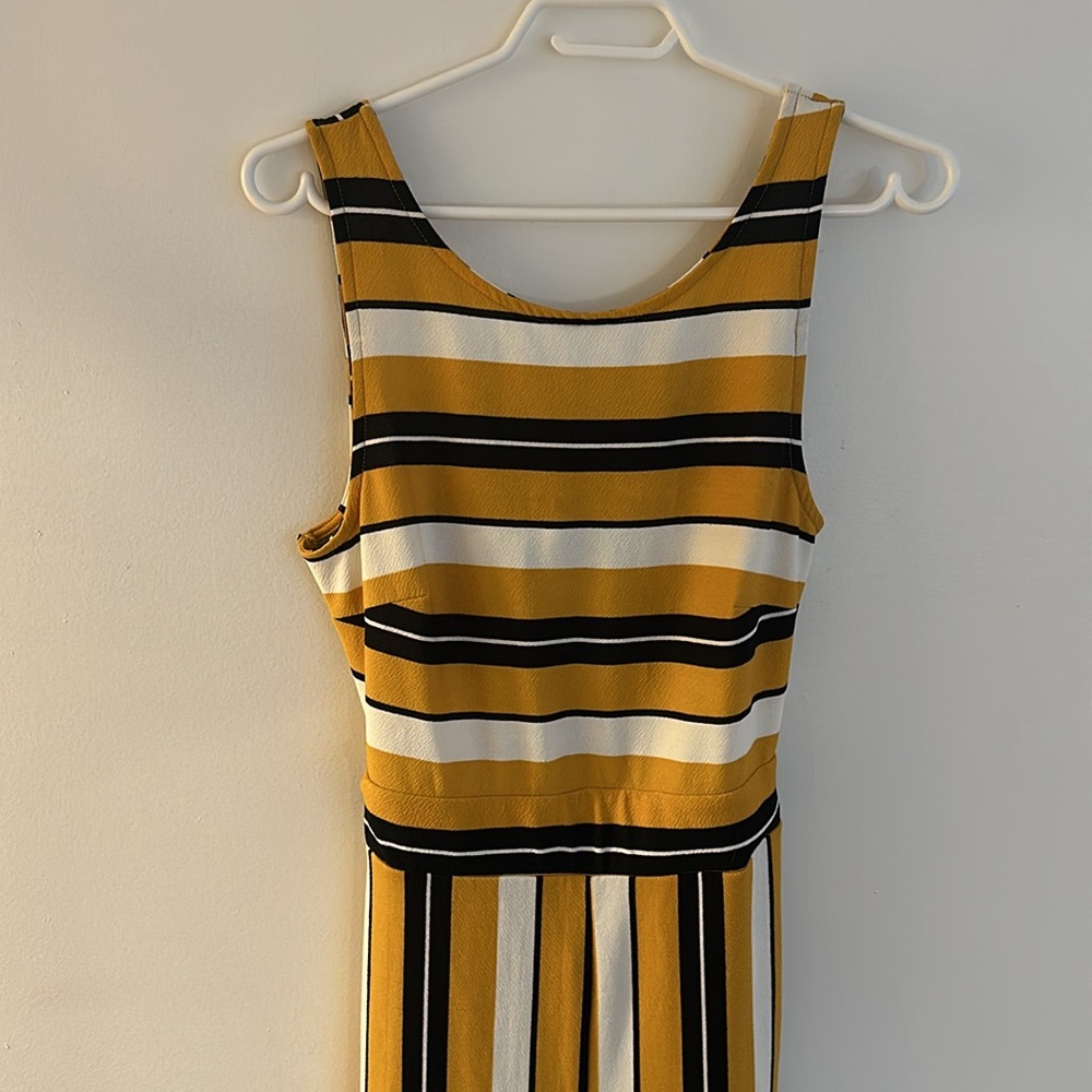 One piece pantsuit. Sleeveless.